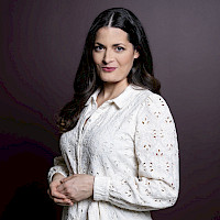 Bild 1: Moderatorin Olivia Röllin